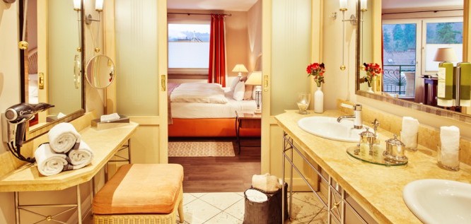 View from the bathroom to the double bed in the Toscana room of the Wellness Resort Romantischer Winkel in the Harz Mountains, Bad Sachsa